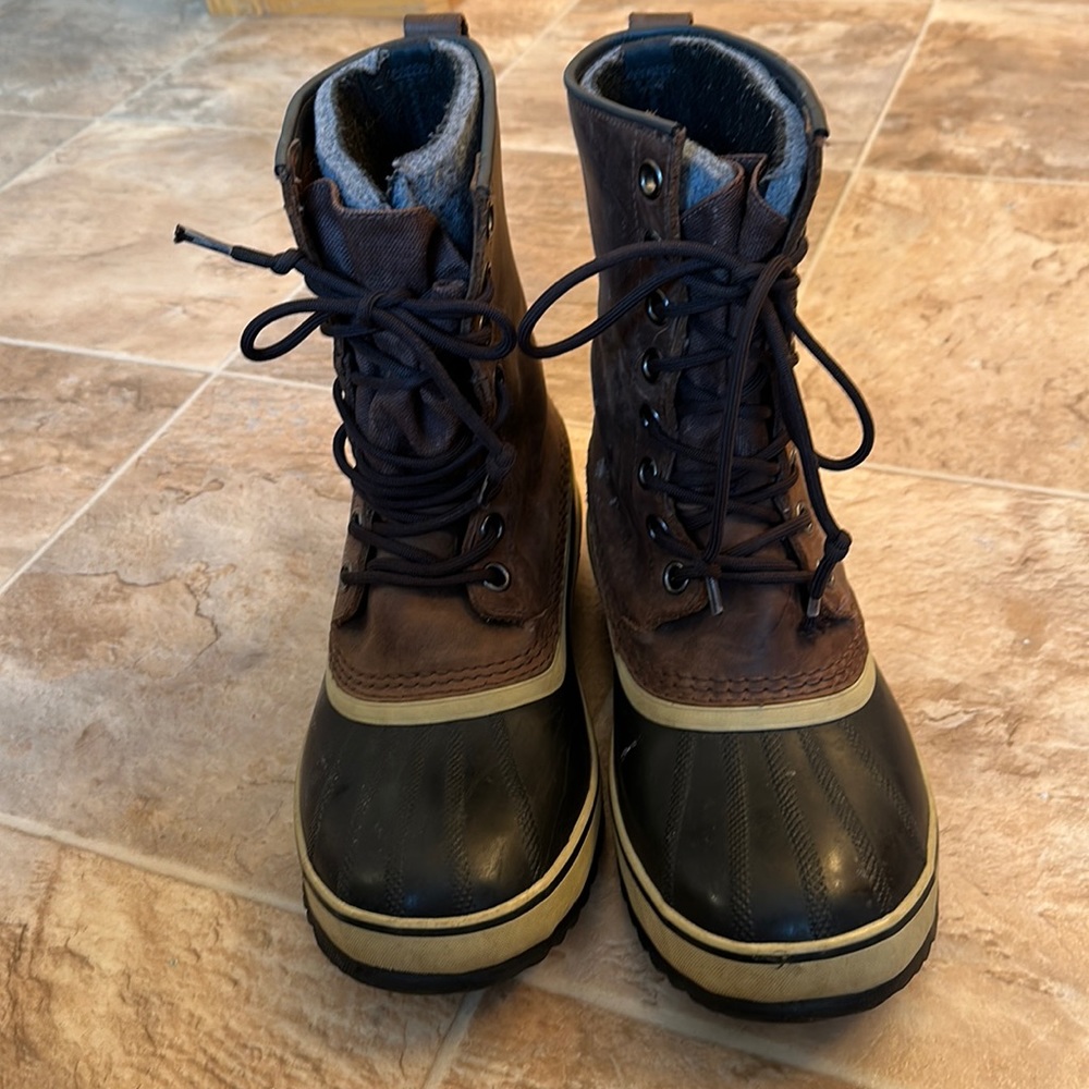 Brown and black men’s winter Sorel boots